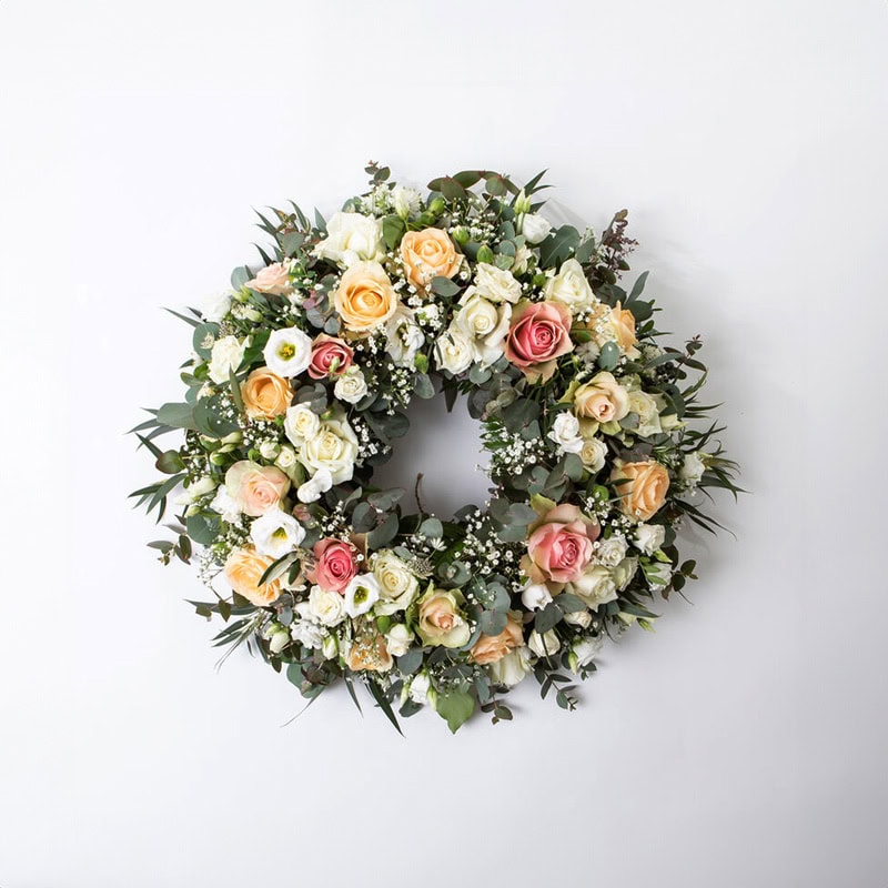 Krans fersken og rosa liten begravelse bisettelse blomster